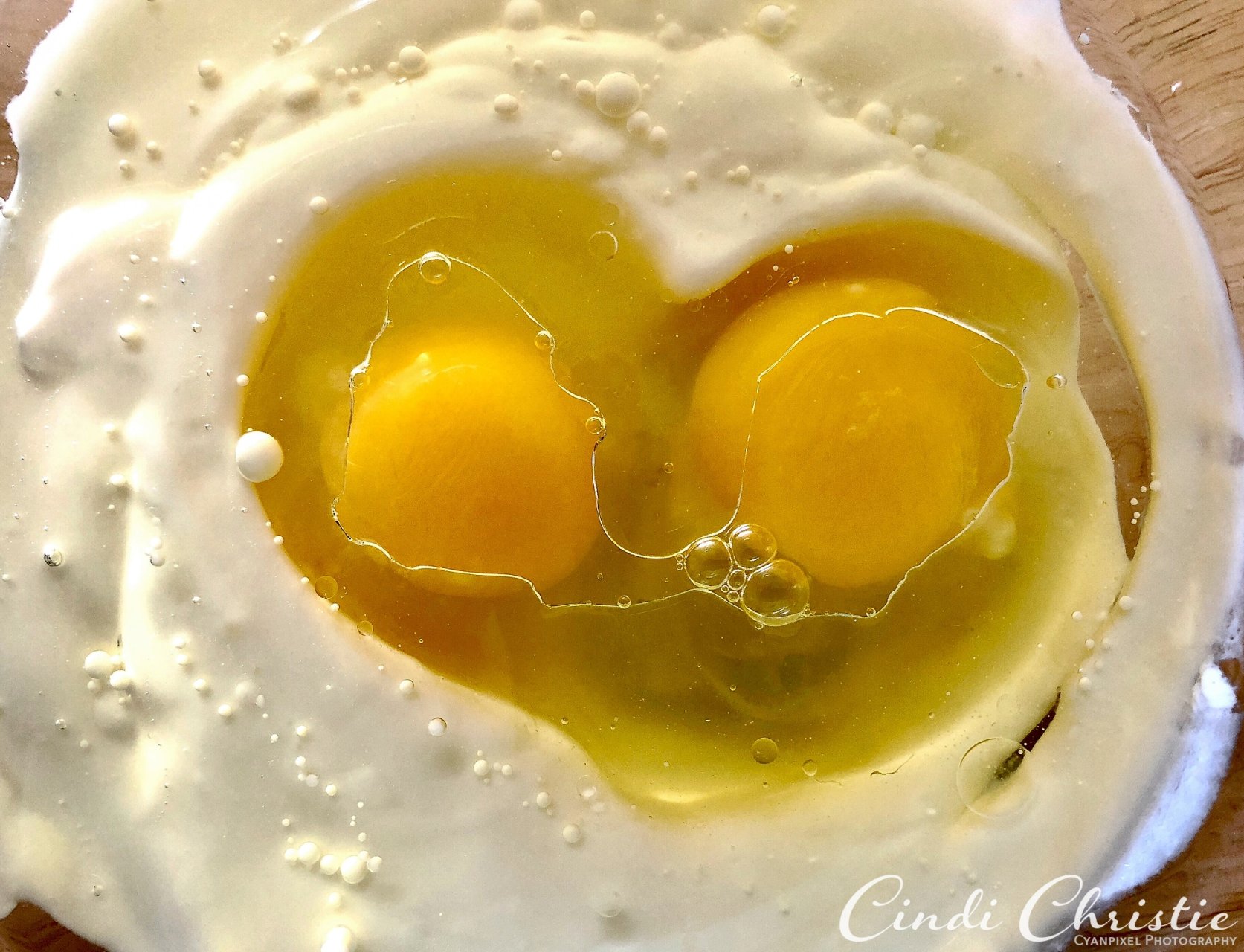 Eggs dropped into a mixture of vegetable oil and plain yogurt form the shape of a heart on Thursday, Sept. 6, 2018, in Salmon, Idaho. The ingredients are part of a loaf of zucchini bread. (Cindi Christie/Cyanpixel Photography)