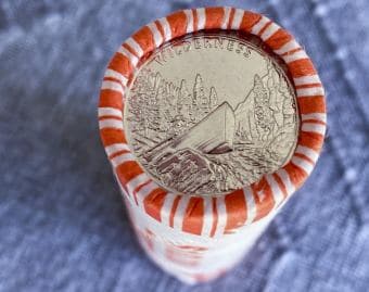 A roll of newly released Frank Church River of No Return Wilderness quarters is photographed on Wednesday, Nov. 6, 2019, following a ceremony at Salmon Junior-Senior High School in Salmon, Idaho, Salmon, Idaho. The coin is the 50th in the U.S. Mint’s America the Beautiful series of quarters. The coin shows a drift boat pilot navigating the wild River of No Return among its features. (© 2019 Cindi Christie/Cyanpixel)